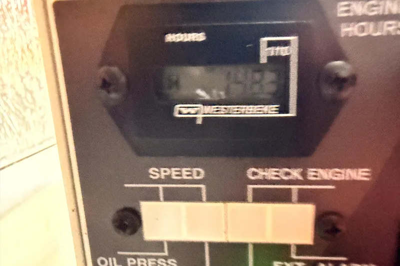 Slide: The Image of Engine hour meter on 2020 Cruisers Yachts 390 Express Coupe dashboard. - 90