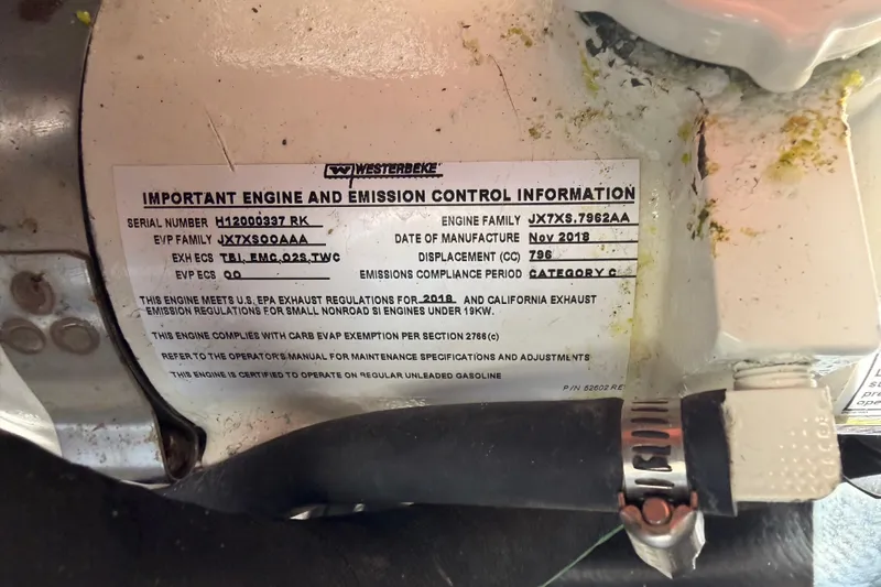 Slide: The Image of Engine and emission control information label on 2020 Cruisers Yachts 390 Express Coupe. - 92