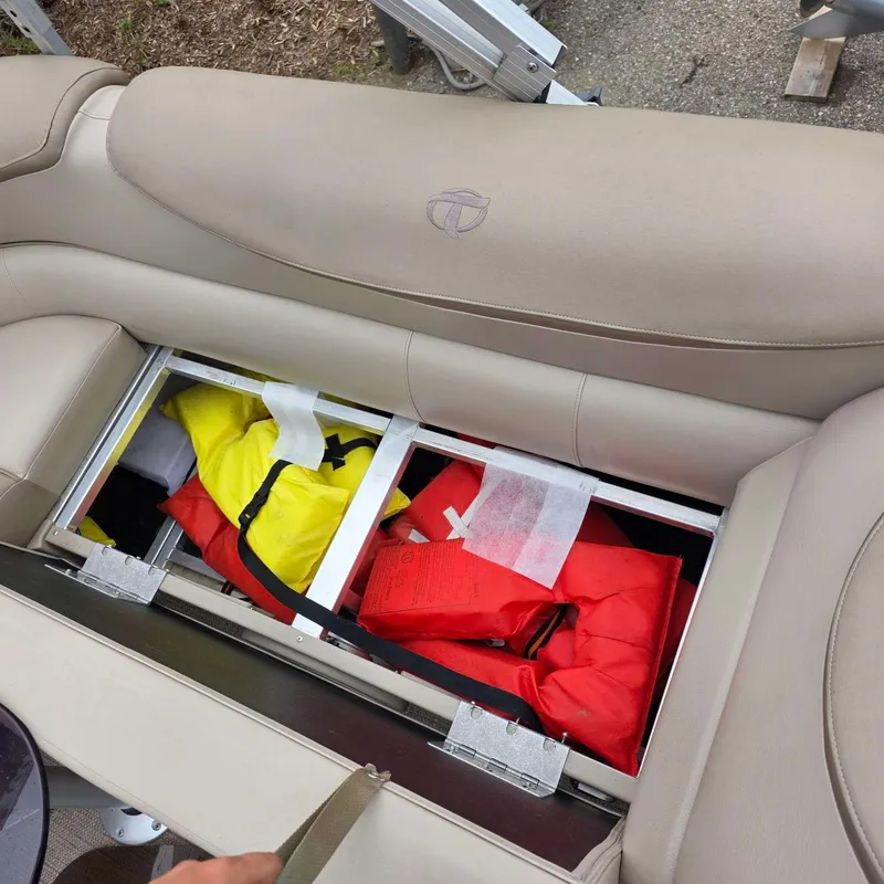 Slide: The Image of 2017 Tahoe CASCADE seat storage with life jackets. - 11