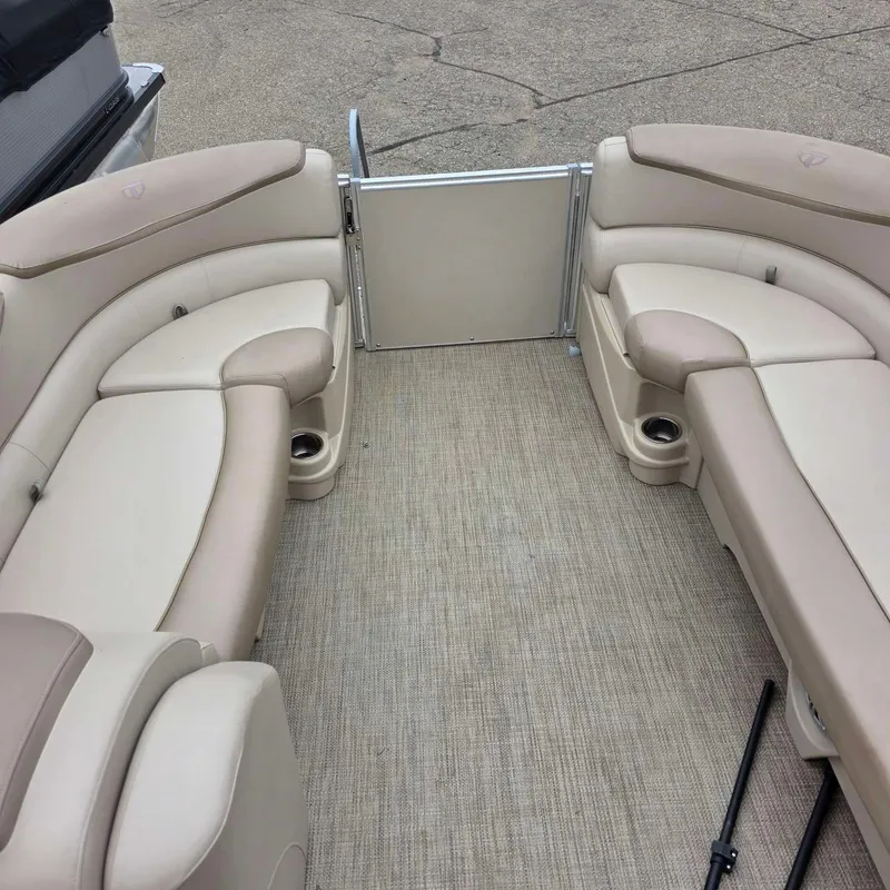 Slide: The Image of Interior of a 2017 Tahoe CASCADE pontoon boat with beige seating. - 12
