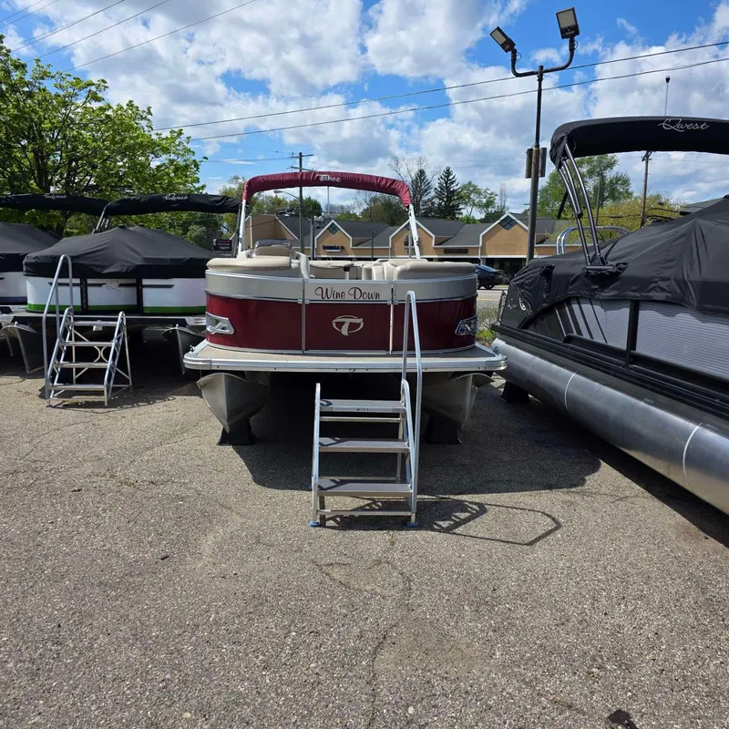 Slide: The Image of 2017 Tahoe CASCADE pontoon boat parked with ladder. - 3