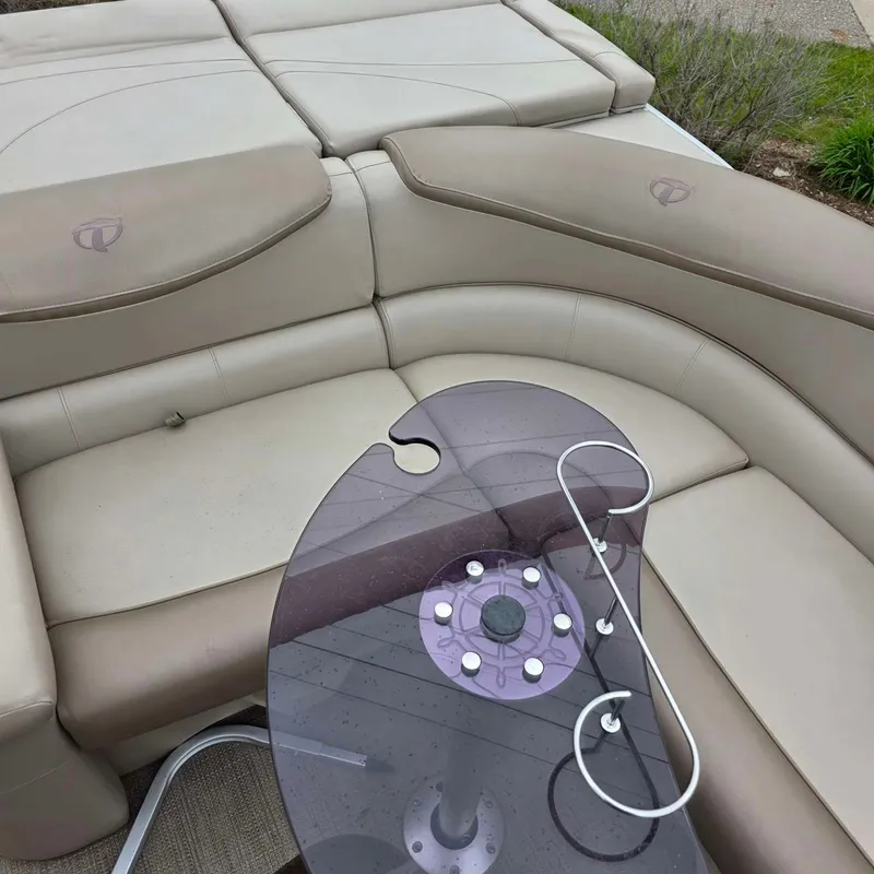 Slide: The Image of 2017 Tahoe CASCADE boat with beige leather seating and table. - 8