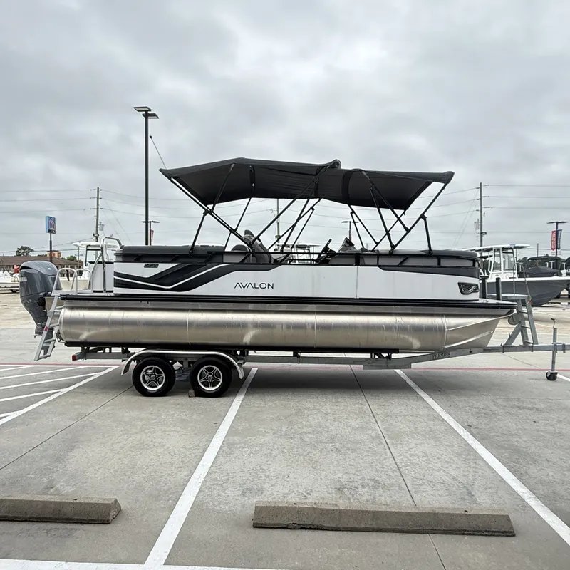 Slide: The Image of 2025 Avalon Venture 85 Quad Lounge pontoon boat on trailer. - 7