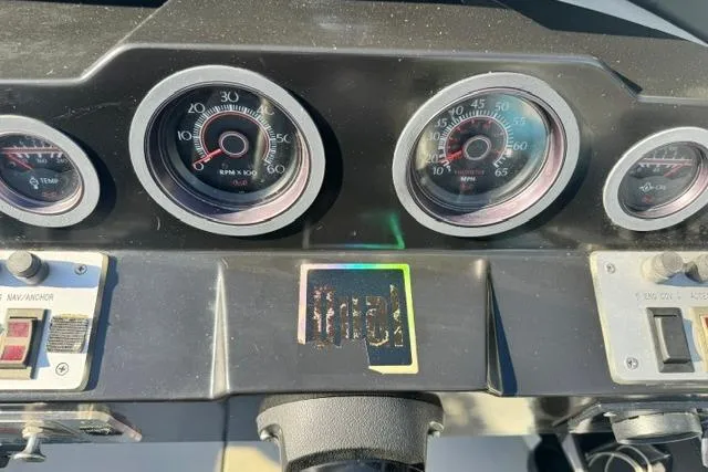 Slide: The Image of Dashboard of a 1984 Wellcraft 22 Scarab boat with gauges and controls. - 3