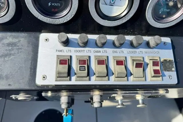 Slide: The Image of Control panel of a 1984 Wellcraft 22 Scarab boat with labeled switches and gauges. - 5