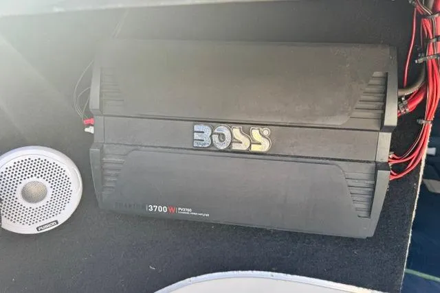 Slide: The Image of Boss audio amplifier and speaker in a 1984 Wellcraft 22 Scarab boat. - 8