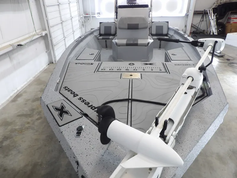 Slide: The Image of 2019 Xpress H20B Bay boat in a garage. - 10