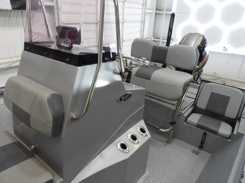 Slide: The Image of Interior of a 2019 Xpress H20B Bay boat with gray seating. - 14
