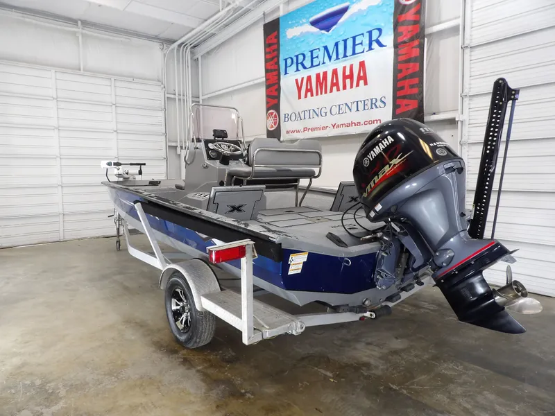 Slide: The Image of 2019 Xpress H20B Bay boat with Yamaha motor in showroom. - 8