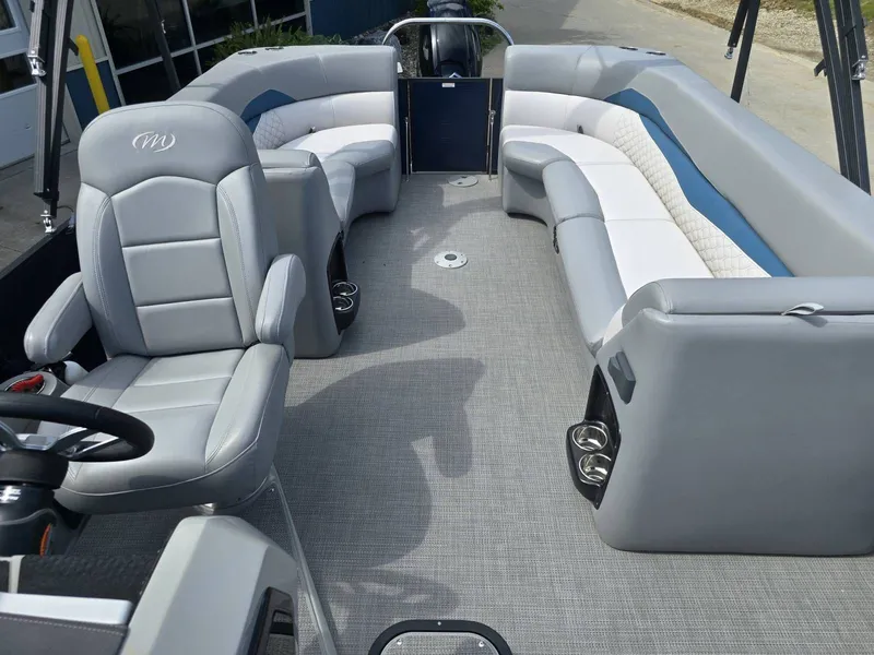 Slide: The Image of Interior of 2022 Manitou 23 Encore RF SHP with gray leather seating. - 14