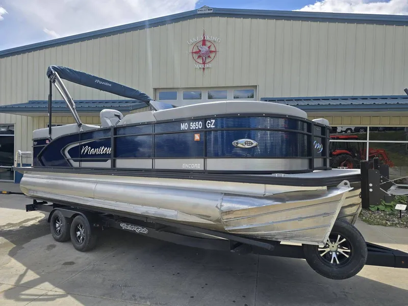 Slide: The Image of 2022 Manitou 23 Encore RF SHP pontoon boat on trailer. - 6