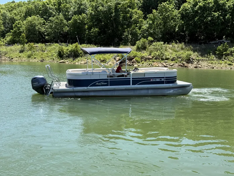 Slide: The Image of 2016 SunChaser 8524 LR pontoon boat on a calm lake. - 10