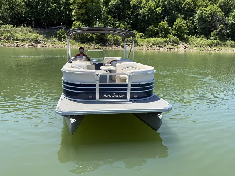 Slide: The Image of 2016 SunChaser 8524 LR pontoon boat on calm lake. - 11