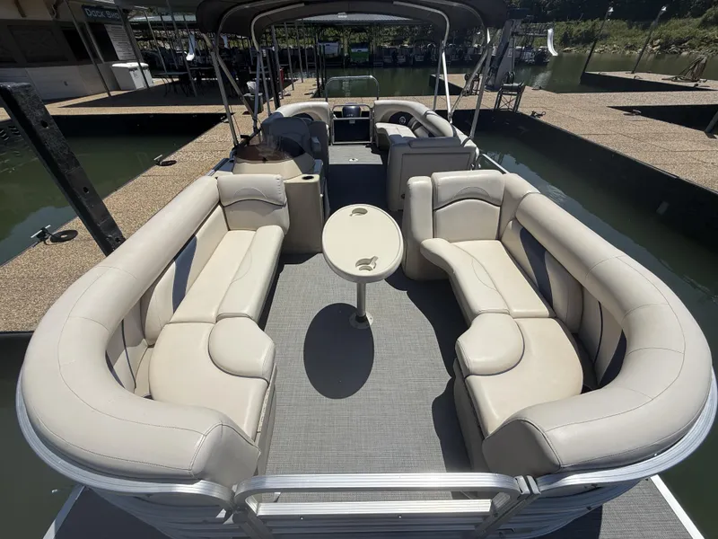 Slide: The Image of Interior of a 2016 SunChaser 8524 LR pontoon boat with beige seating. - 13