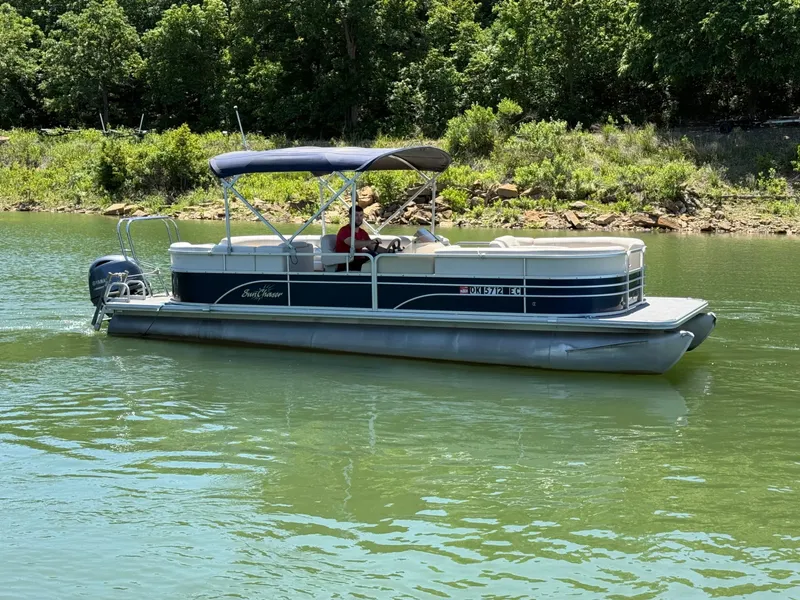 Slide: The Image of 2016 SunChaser 8524 LR pontoon boat on a tranquil lake. - 17