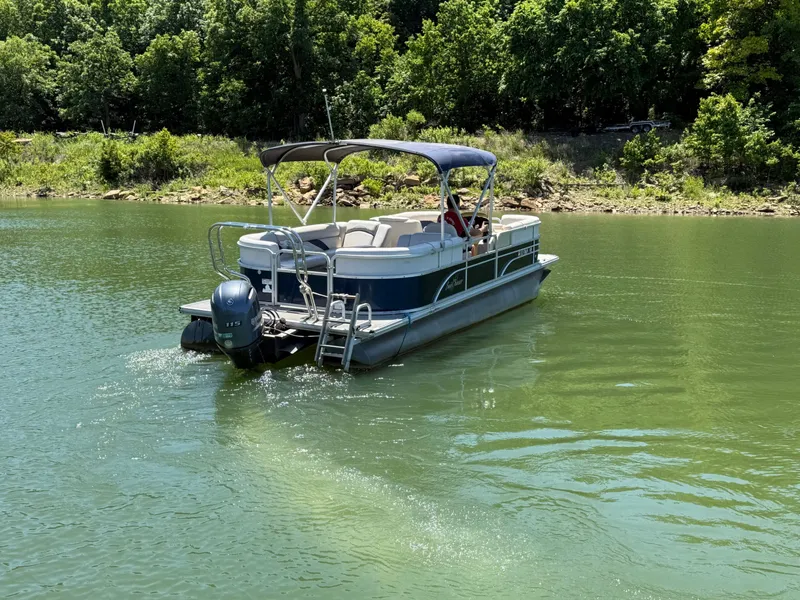 Slide: The Image of 2016 SunChaser 8524 LR pontoon boat on a serene lake. - 21