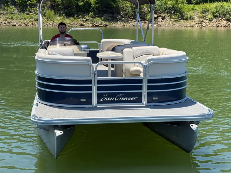 Slide: The Image of 2016 SunChaser 8524 LR pontoon boat on a lake. - 22