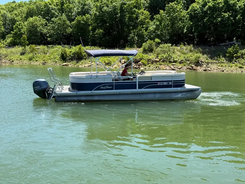 Slide: The Image of 2016 SunChaser 8524 LR pontoon boat on a serene lake. - 25