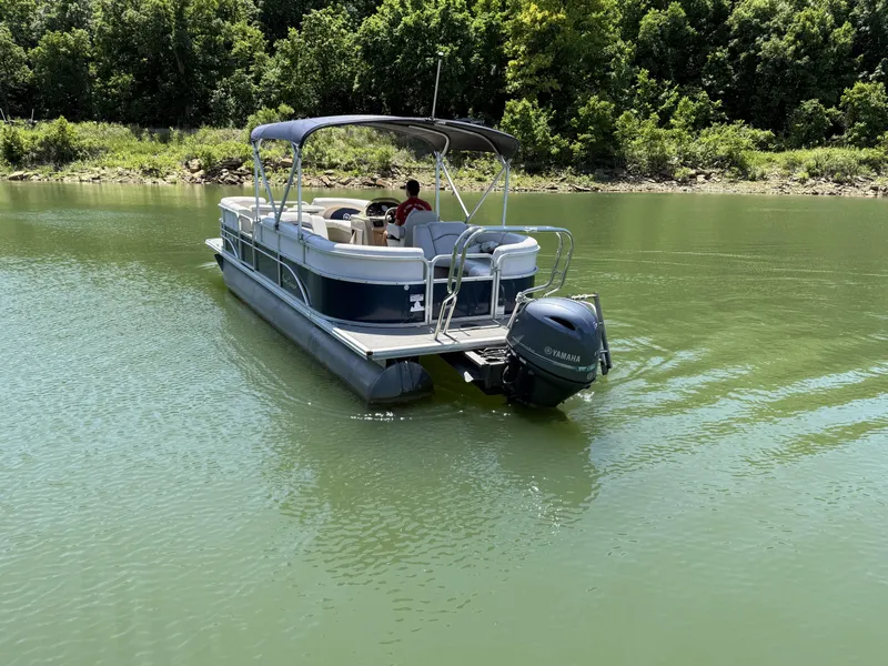 Slide: The Image of 2016 SunChaser 8524 LR pontoon boat on green water. - 5