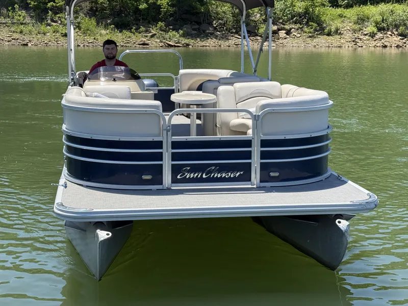 Slide: The Image of SunChaser 8524 LR pontoon boat on a calm lake, 2016 model. - 7