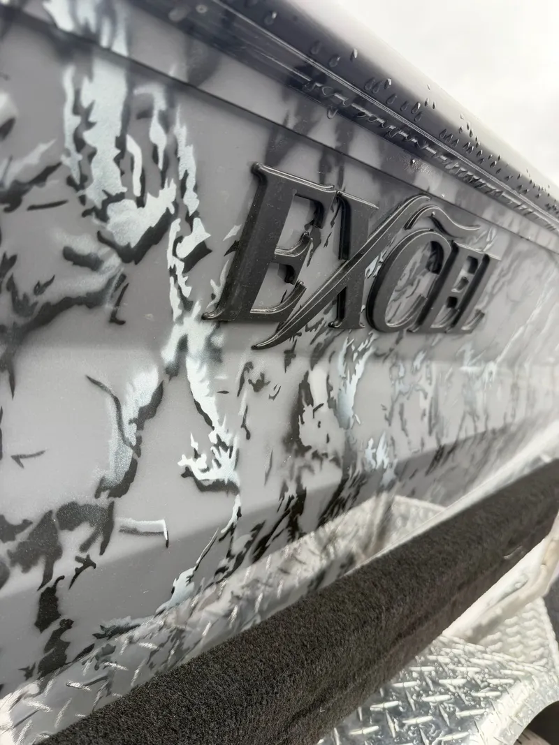 The Image of Close-up of Excel 183 Tomahawk boat, 2026 model, featuring camouflage pattern. - 1