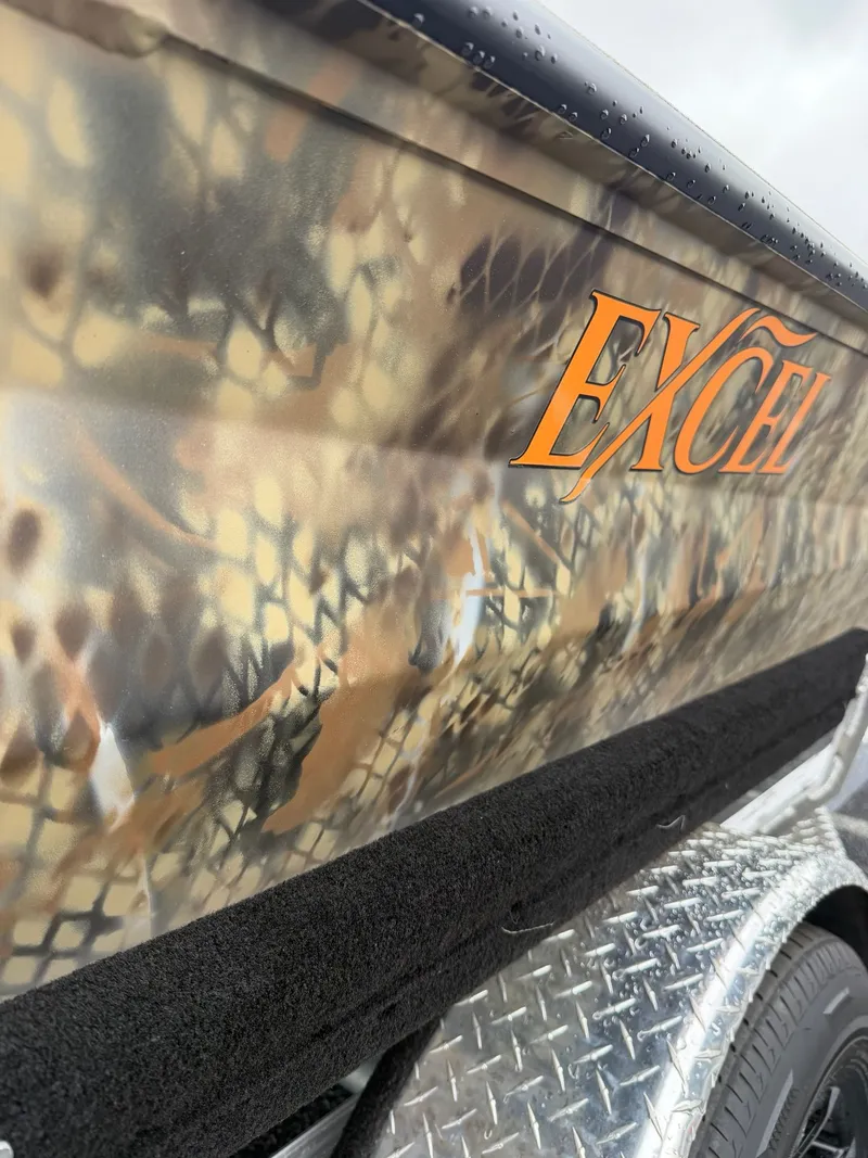 The Image of 2026 Excel 183 Tomahawk boat with camouflage pattern and logo. - 1