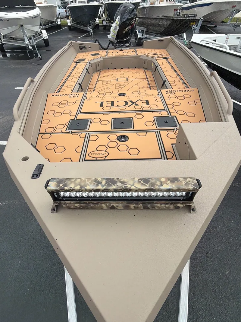 Slide: The Image of 2026 Excel 183 Tomahawk boat with modern design and camouflage details. - 4