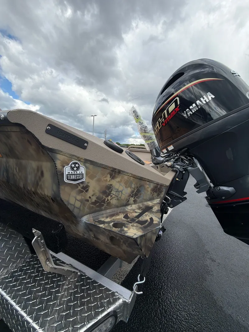 Slide: The Image of 2026 Excel 183 Tomahawk boat with Yamaha motor, Tennessee sticker. - 6