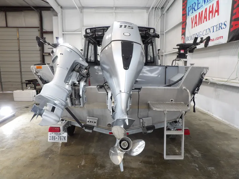 Slide: The Image of Rear view of a 2018 Hewescraft 20 PRO V with dual outboard motors. - 5