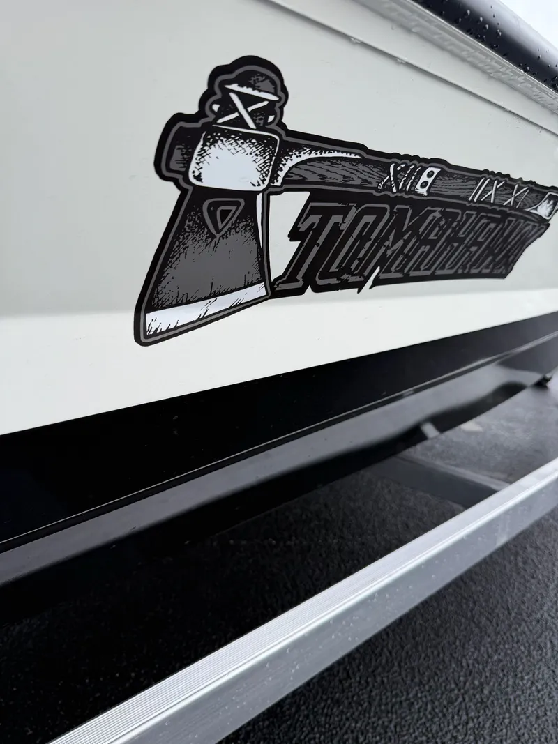 Slide: The Image of Excel 183 Tomahawk 2026 boat with tomahawk logo. - 2