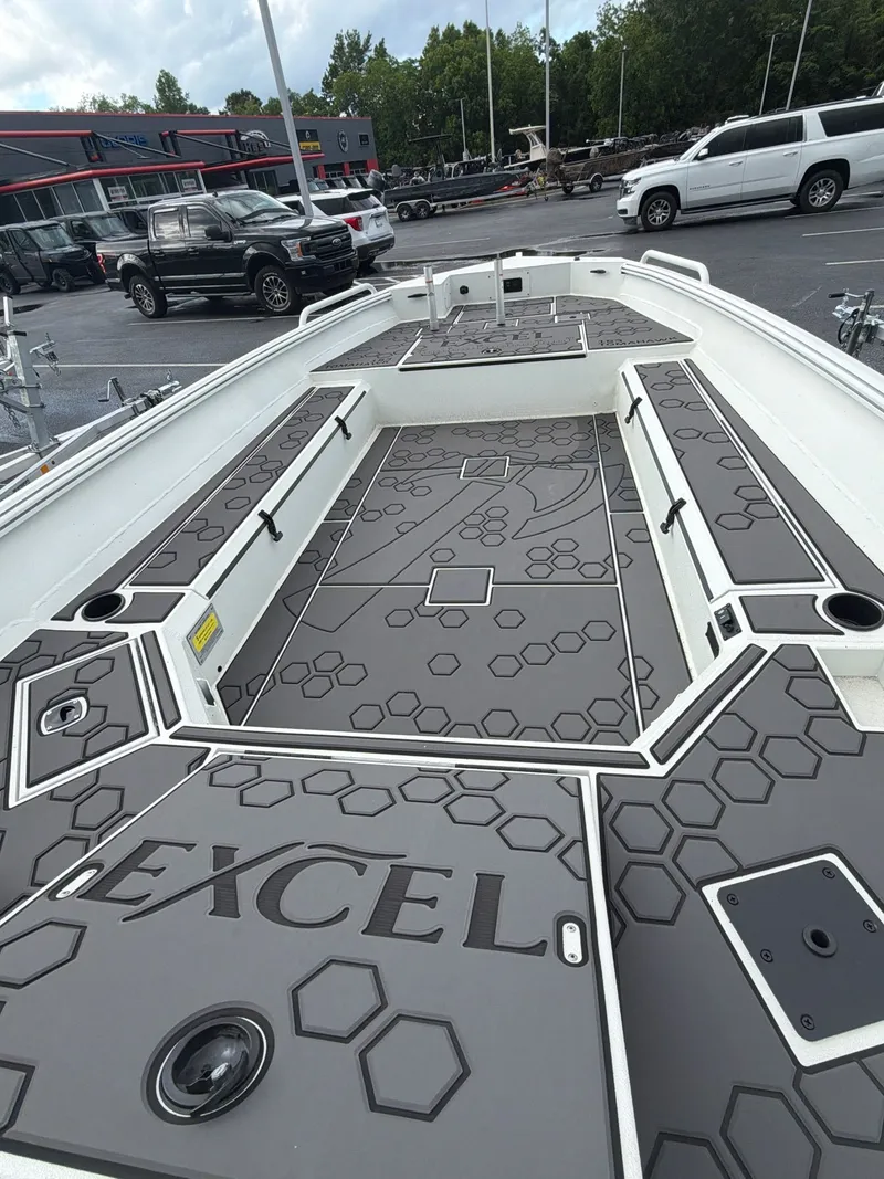 Slide: The Image of 2026 Excel 183 Tomahawk boat with modern design on parking lot. - 3