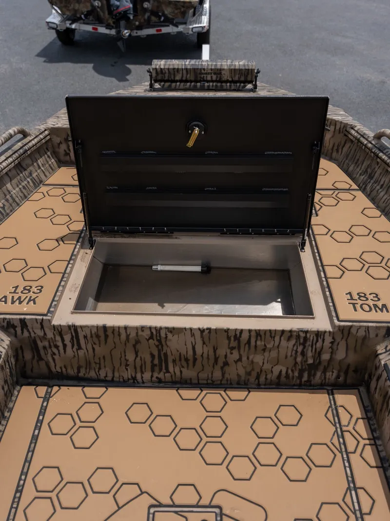 Slide: The Image of Excel 183 Tomahawk 2026 boat with open storage compartment. - 10