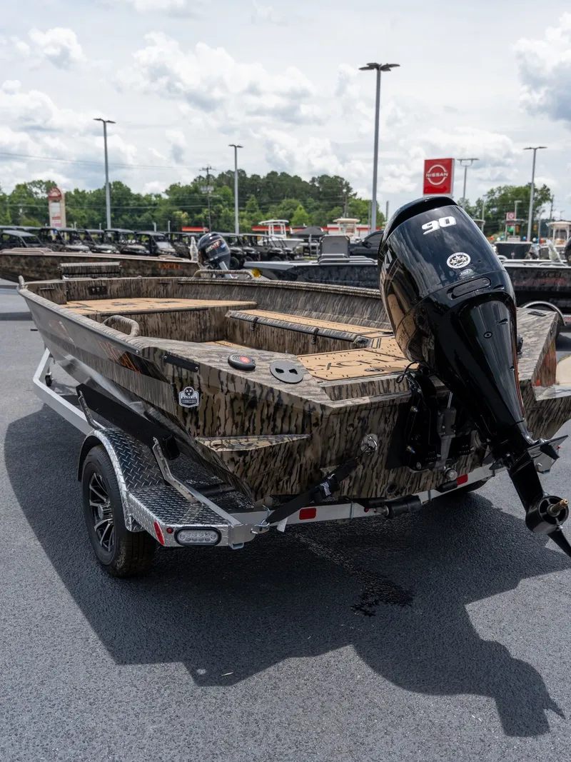 Slide: The Image of Excel 183 Tomahawk boat 2026 with outboard motor on trailer. - 4