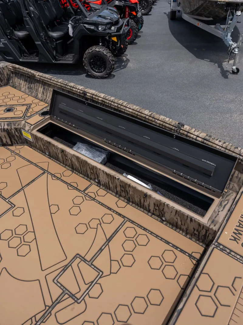 Slide: The Image of Excel 183 Tomahawk 2026 with storage compartment and camouflage pattern. - 9