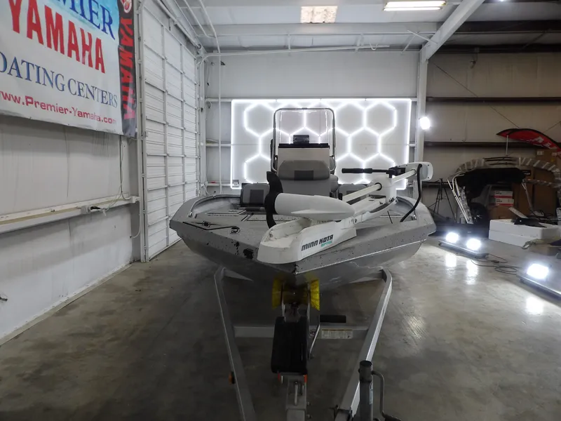 Slide: The Image of 2019 Xpress H20B Bay boat in a workshop. - 6
