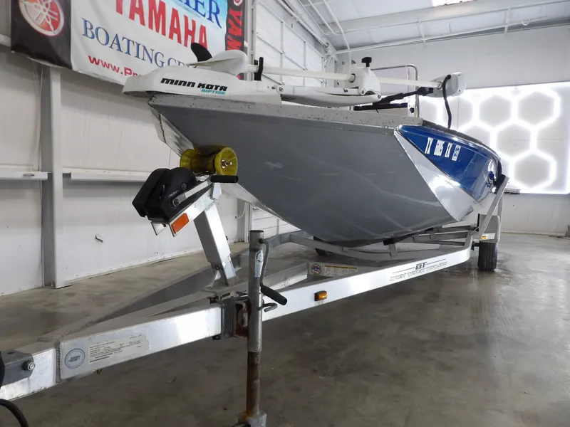 Slide: The Image of 2019 Xpress H20B Bay boat on trailer in warehouse. - 7
