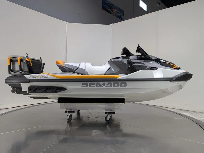 Slide: The Image of 2025 Sea-Doo FishPro Trophy 170 jet ski in a showroom. - 29