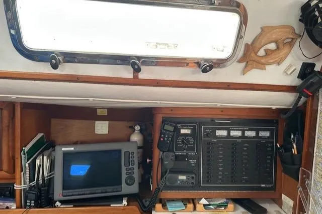 Slide: The Image of 1996 Freedom 35 yacht interior with navigation equipment and control panel. - 7