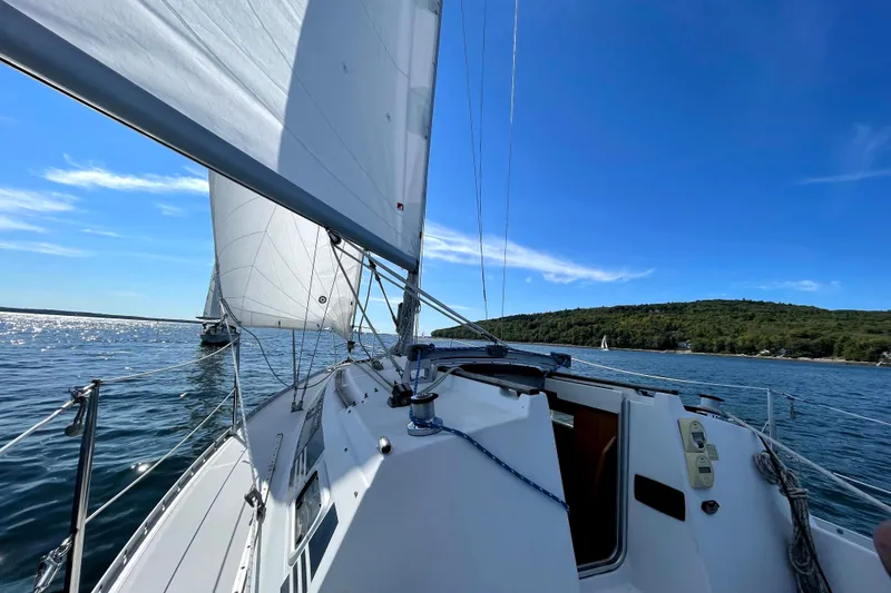 Slide: The Image of Sailing on a 1988 Beneteau First 285 yacht under clear blue skies. - 3