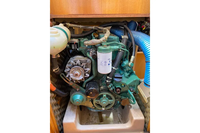 Slide: The Image of Engine compartment of a 1988 Beneteau First 285 sailboat, showcasing mechanical components. - 7
