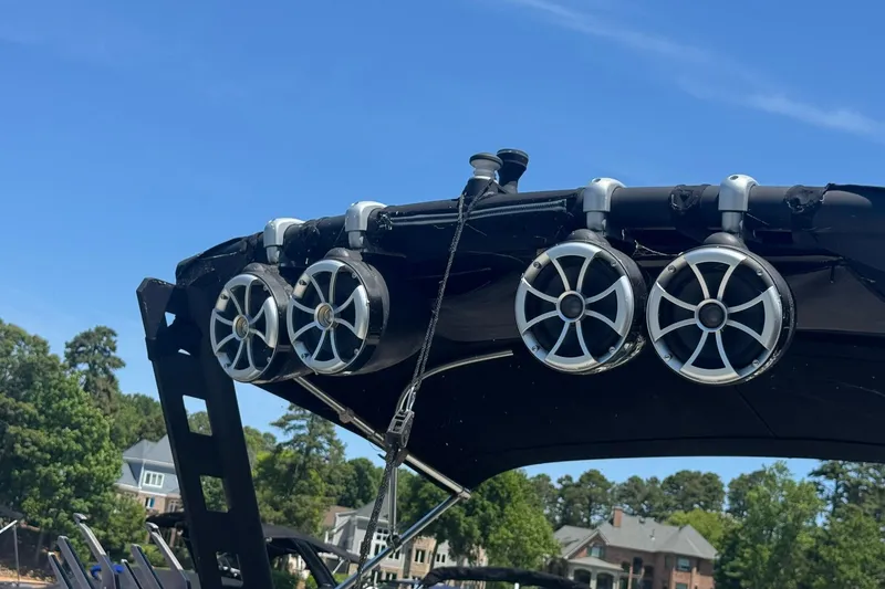 Slide: The Image of Speakers mounted on a 2017 Axis T23 boat against a clear blue sky. - 10
