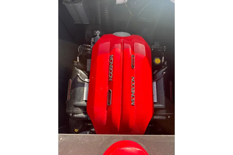 Slide: The Image of Red Monsoon 409 engine in a 2017 Axis T23 boat, showcasing powerful performance. - 11