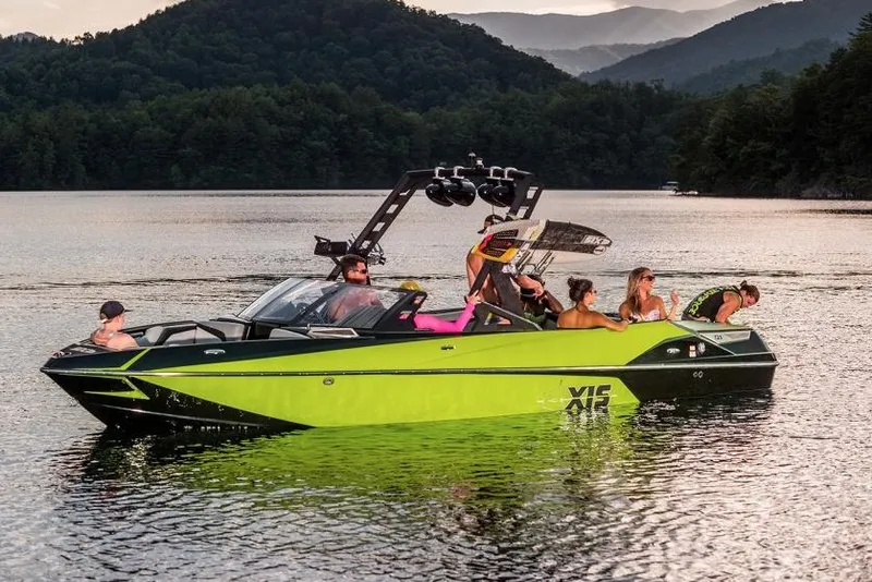 Slide: The Image of Manufacturer Provided Image: 2017 Axis T23 boat on a lake with people enjoying water activities. - 12