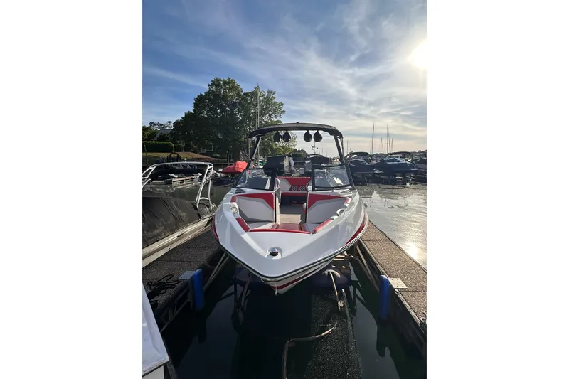 Slide: The Image of 2017 Axis T23 boat docked at marina under clear sky. - 7