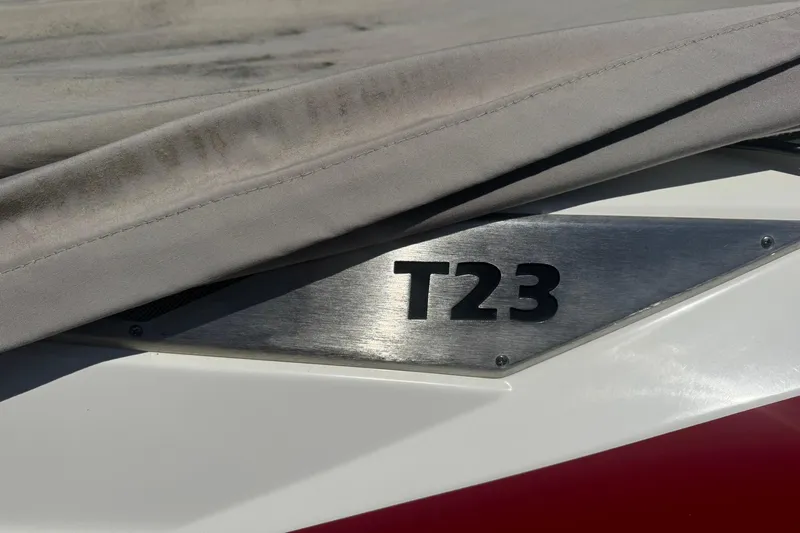 Slide: The Image of 2017 Axis T23 boat partially covered, showcasing model emblem. - 9