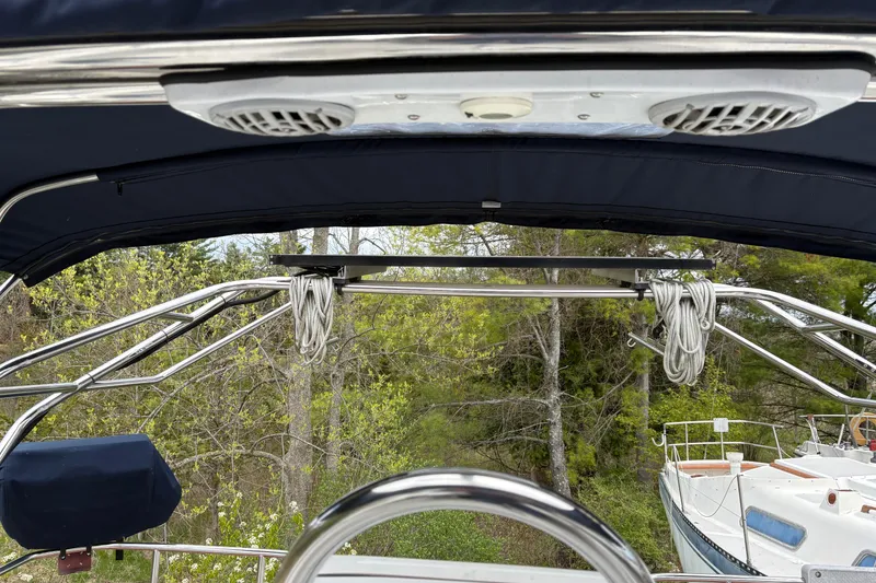 Slide: The Image of 2009 Hunter 41 Deck Salon cockpit view with canopy and rigging details. - 13