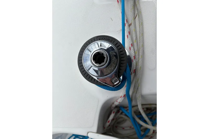 Slide: The Image of Winch on 2009 Hunter 41 Deck Salon sailboat with blue and white ropes. - 17