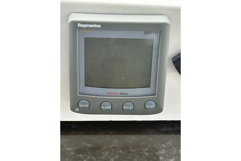 Slide: The Image of Raymarine depth gauge on 2009 Hunter 41 Deck Salon sailboat, featuring Autohelm Series controls. - 21