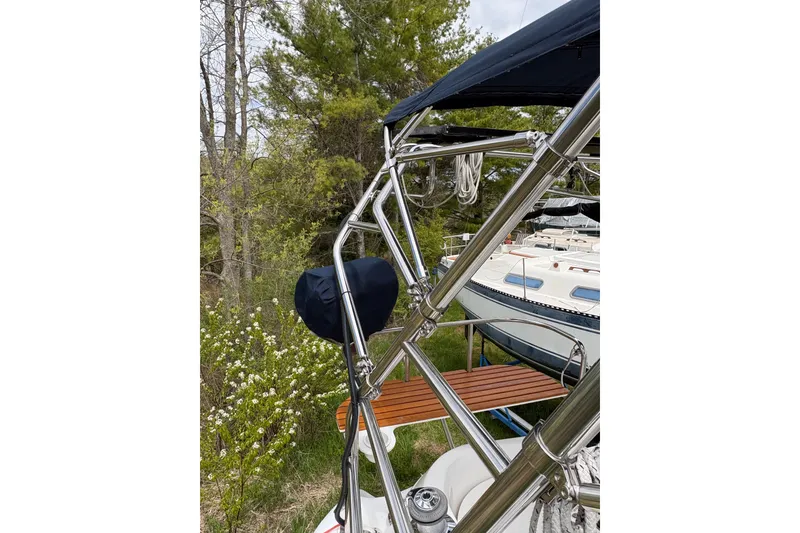 Slide: The Image of Stainless steel rigging on a 2009 Hunter 41 Deck Salon sailboat, surrounded by greenery. - 30