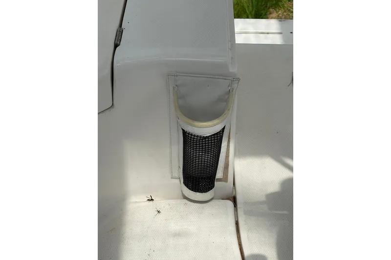 Slide: The Image of White interior detail of a 2009 Hunter 41 Deck Salon sailboat with mesh pocket. - 32